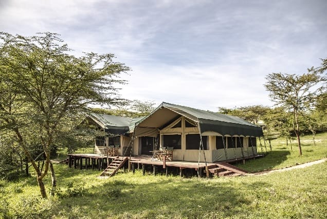 Luxury safari tented camp in the African wilderness surrounded by nature