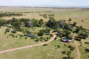 Aerial view of safari lodge tents in African savannah