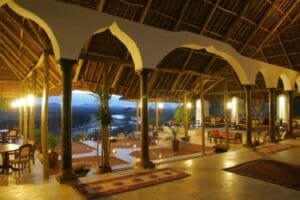 Luxury indoor pool and lounge area with traditional Swahili architecture at a boutique safari lodge in Kenya