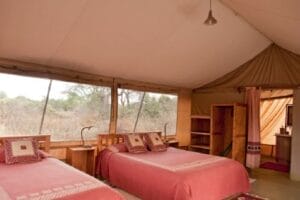 Luxury safari tent with twin beds and en-suite bathroom in Kenya