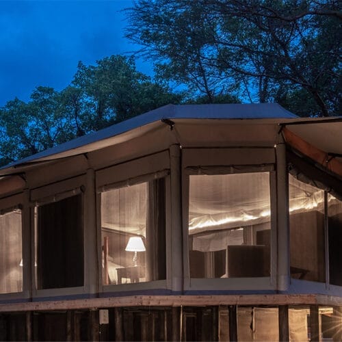 jubileegallery4 | Gamewatchers Safaris Luxury safari tent accommodation illuminated at night in the African wilderness