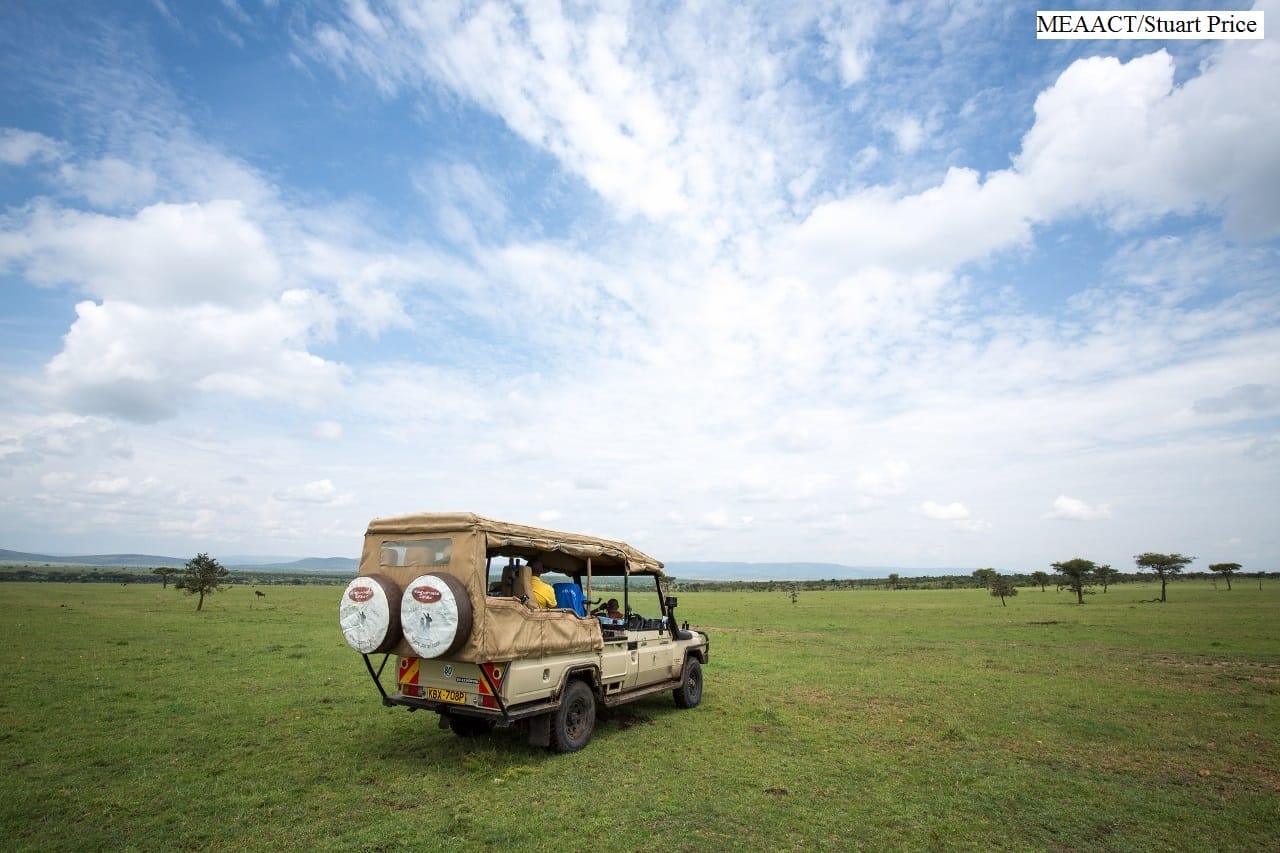 Safari jeep on Maasai Mara plains