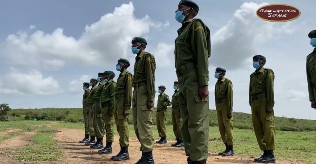 Wildlife rangers in uniform lined up for patrol training with Gamewatchers Safaris in Kenya