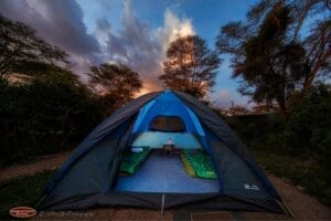 Adventure safari dome tent with twin sleeping bags set up in the wilderness at sunset – Gamewatchers Safaris Kenya