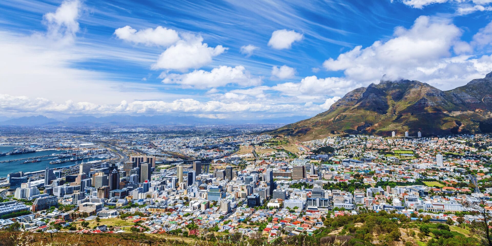 Cape Town city view, traveling to South Africa, many houses on the seashore, beautiful urban panorama, high mountains, summer vacation concept