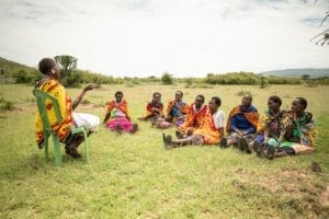 Woman Teaching other Maasai Women - photo credit Edwin Ndeke The Guardian