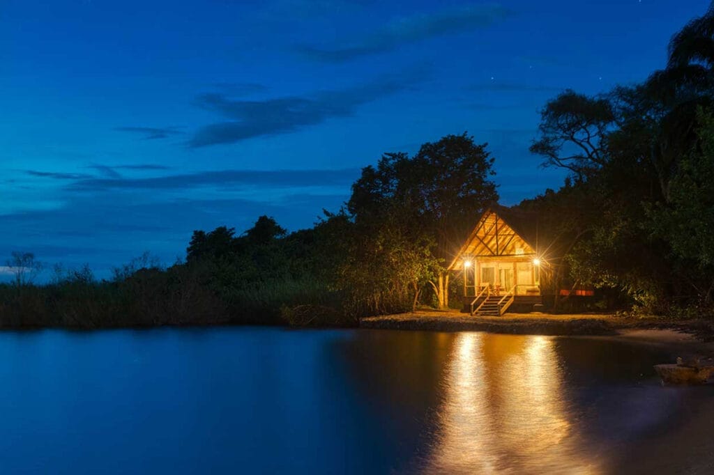 nighttime waterside lodge