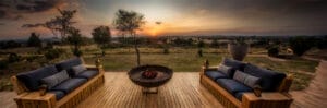 terrace with firepit overlooking sunset