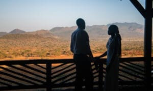 couple on terrace looking over desert