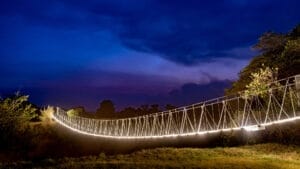 rope bridge with lights on the underside