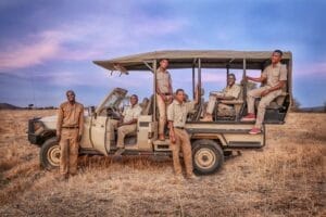 ceam members sat in offroad safari vehicle