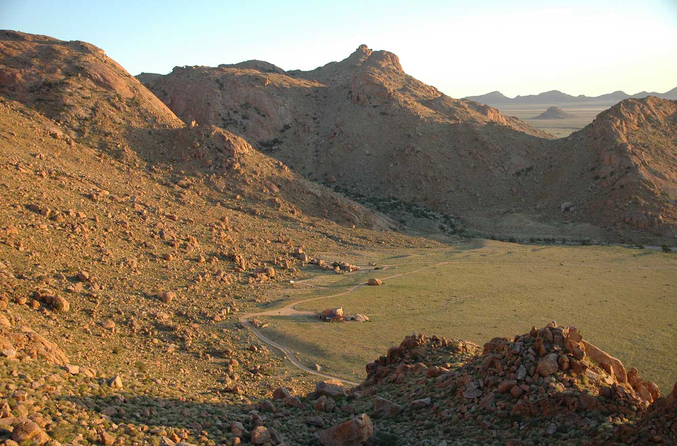 aerial shot of lodge in open space