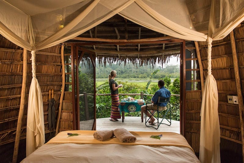 Couple enjoying the view from their terrace at Lango Camp in Congo