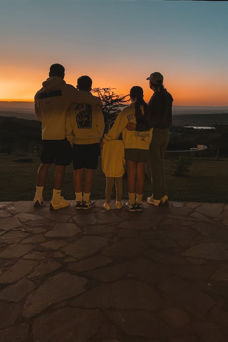 Family looking at sunset at Ol Kinyei Conservancy photo credit Clare Fisher