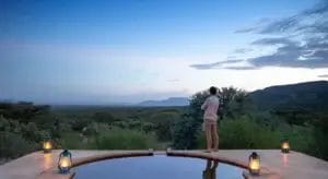 Plunge pool at Lentorre Lodge with man admiring the view