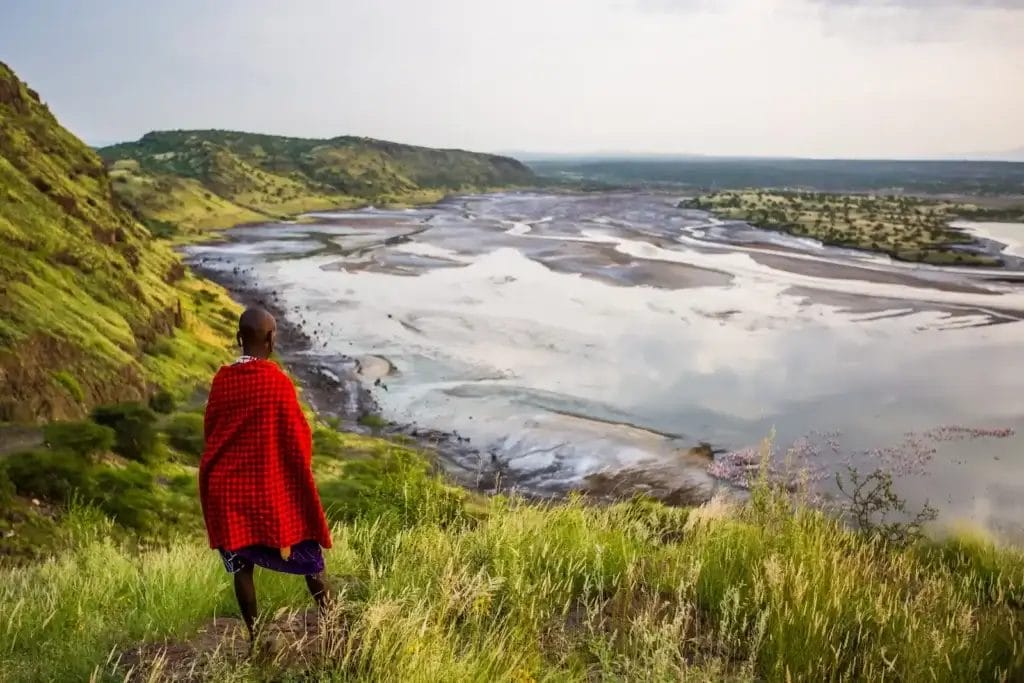Maasai man enjoying the view of the Olkirimatian Conservancy in Kenya