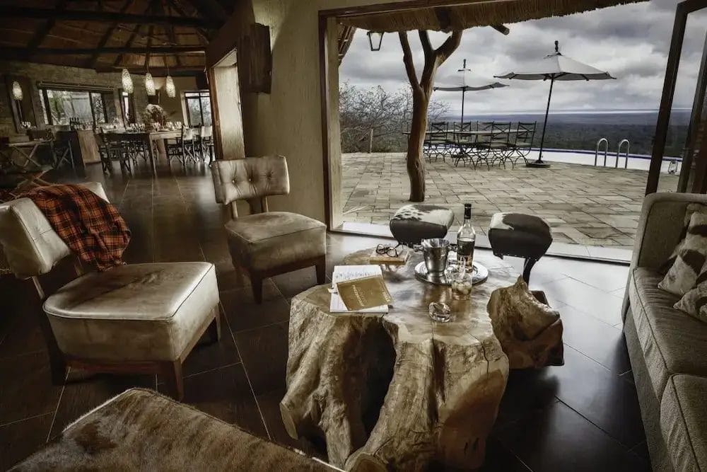 Lounge area with view onto the terrace at Ilaroi in Tanzania
