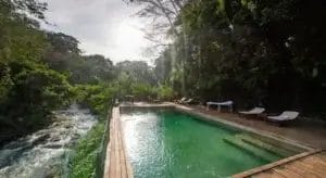 Swimming pool in the forest at Rhino River Camp in Meru Kenya.