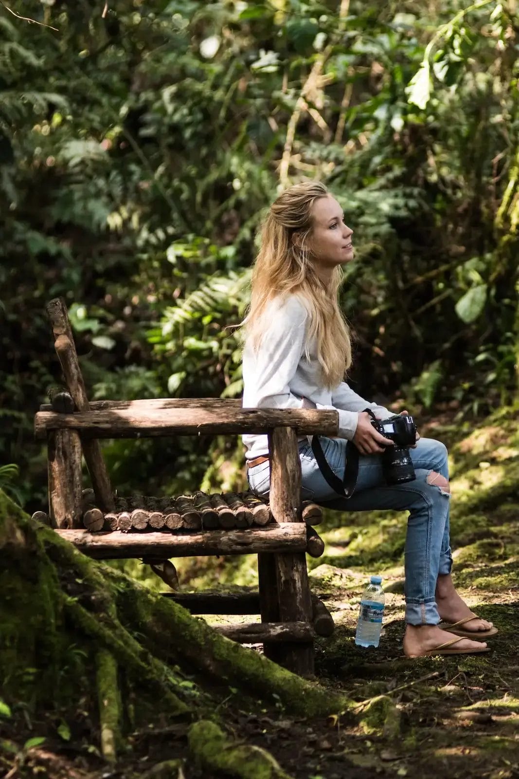 Guest on a bench at Bwindi Lodge in Uganda